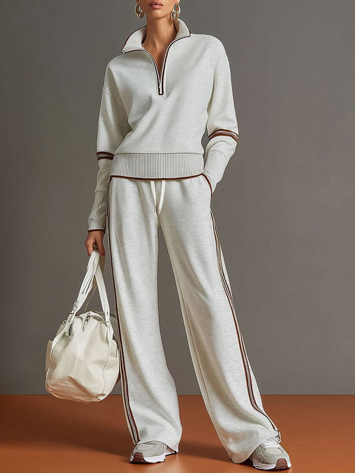 Relaxed fit women's two-piece loungewear. Cozy polyester set with a flowing silhouette & wide leg for style.