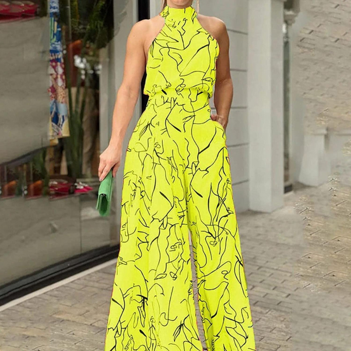 Flowy sleeveless wide-leg jumpsuit for women, with a stylish belt, great for summer fashion & elegance.