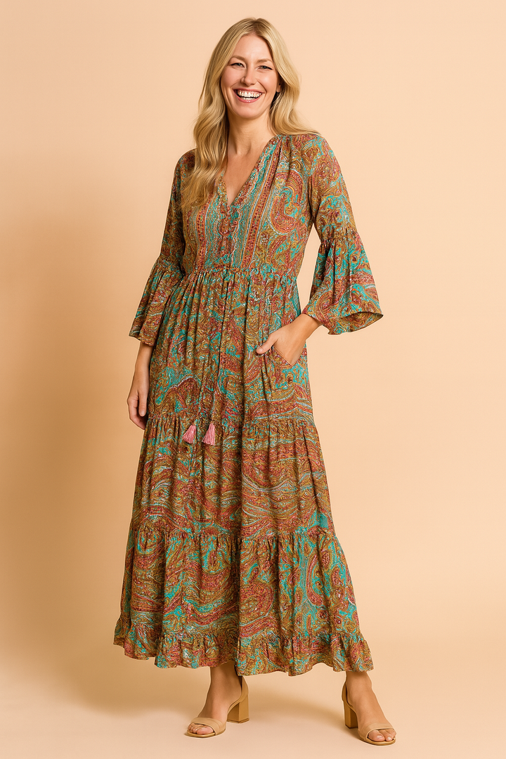 Flowy women's bohemian maxi dress with elegant long sleeves, perfect for a chic and casual summer style.