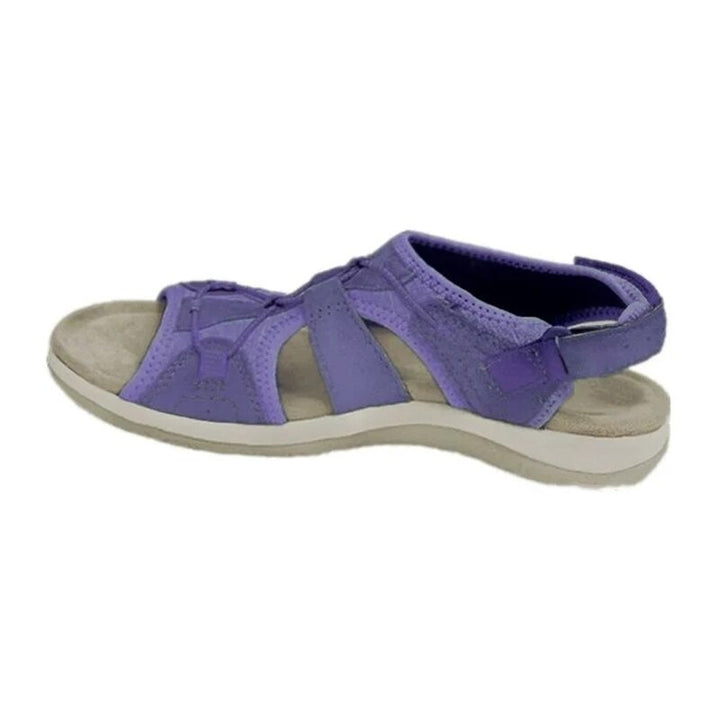 Comfortable women's beach sandals with sporty design and adjustable straps for fit.
