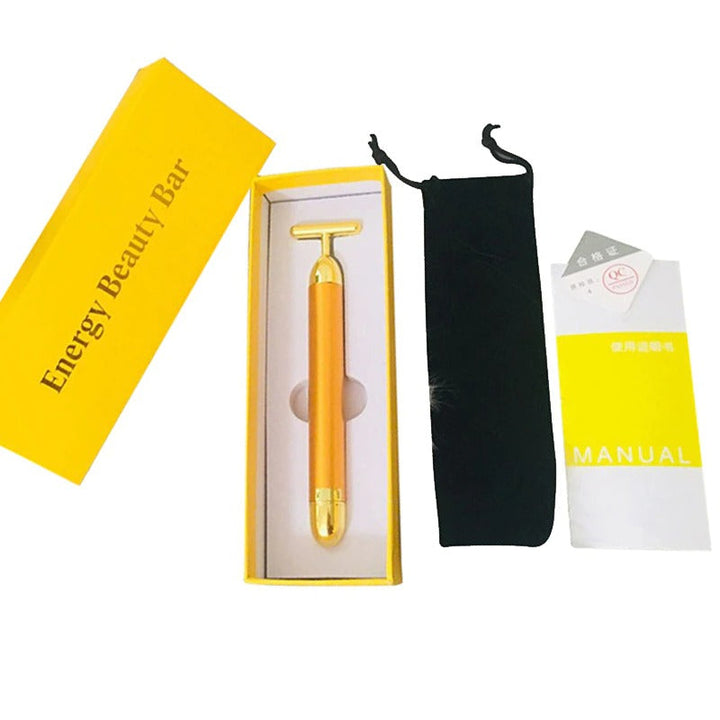 Close-up of a unisex vibrating facial roller gently massaging skin for a radiant, youthful complexion.