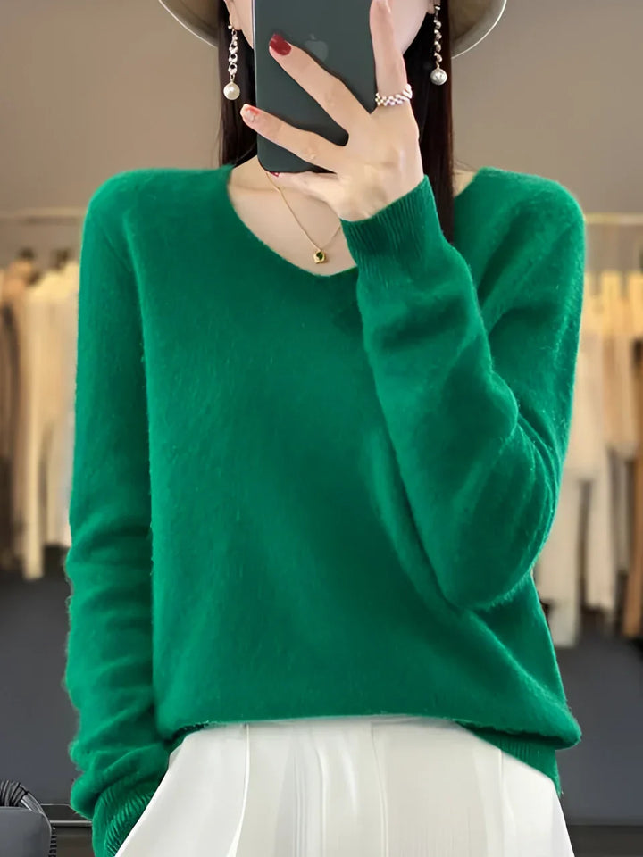 Women's elegant V-neck knit sweater, perfect for cozy fall & winter layering.