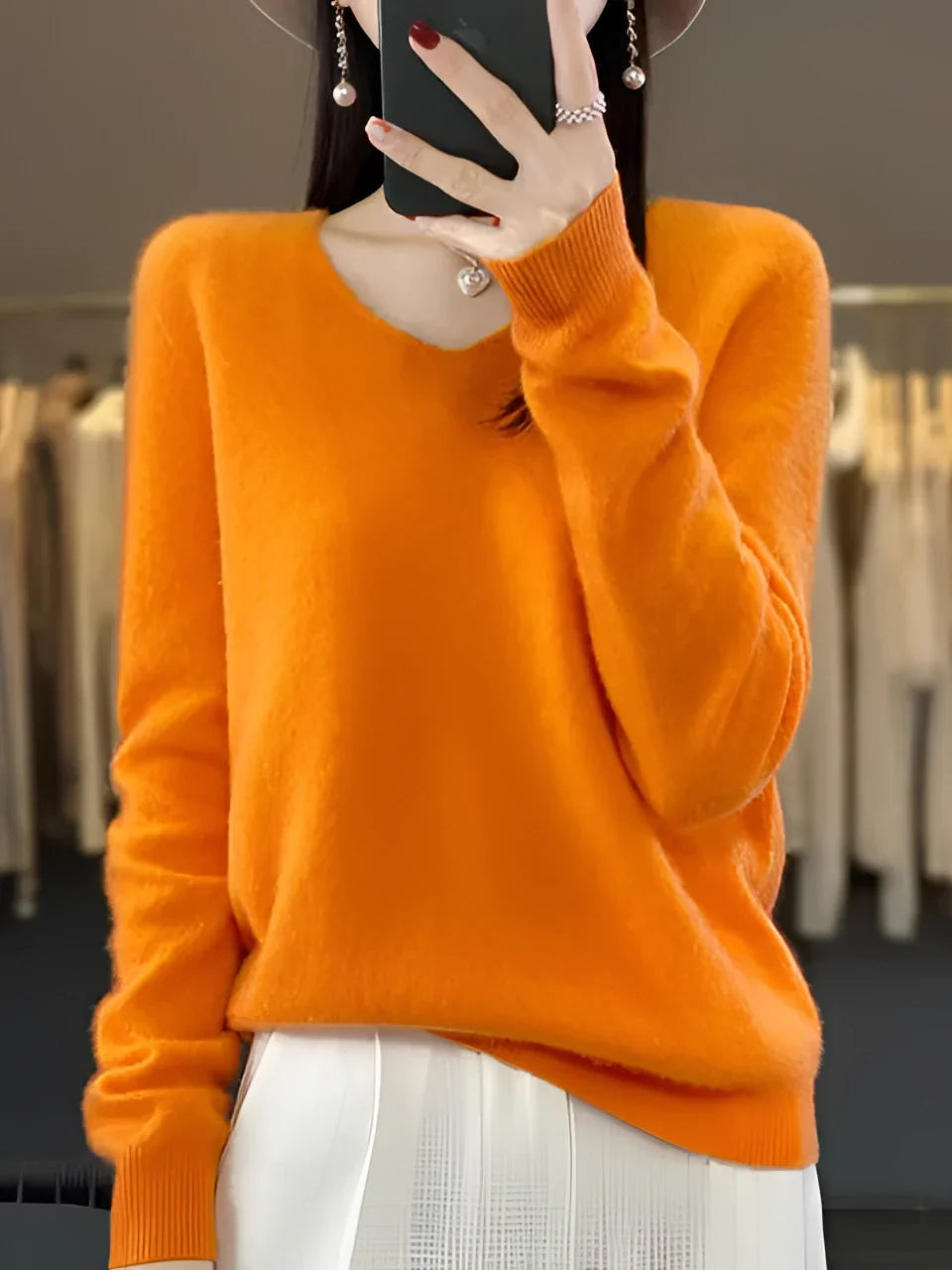 Warm women's V-neck knit sweater, a cozy long-sleeve top for essential winter wear & fall layering.