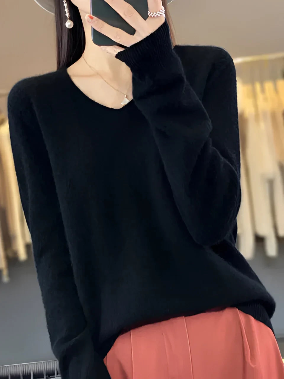 Chic women's V-neck knit sweater with long sleeves, ideal for elegant everyday style or office wear.