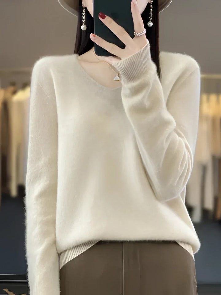 Comfortable & soft women's V-neck knit sweater. A cozy, versatile long-sleeve top for fall fashion.