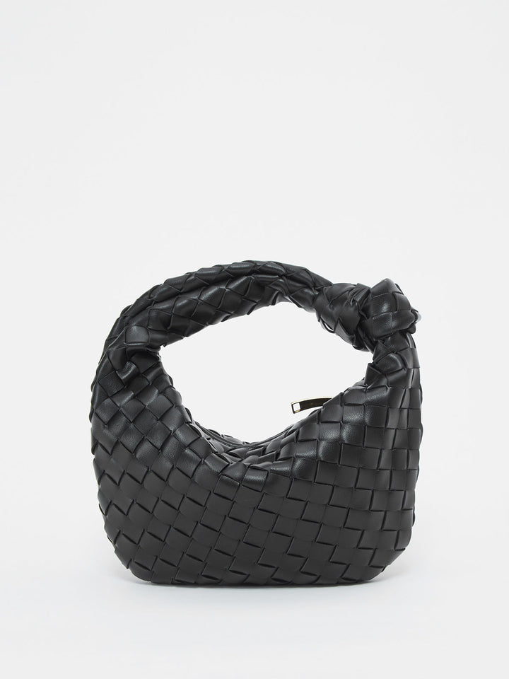 Textured braided shoulder bag for women with unique knot handles, perfect for a casual look.