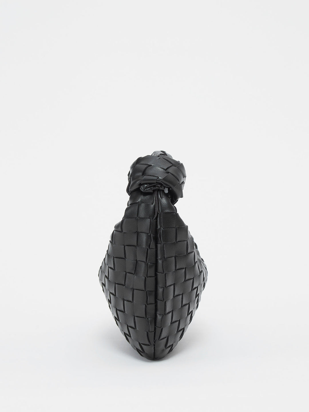 Elegant women's handbag featuring a distinctive braided knot handle, a chic fashion accessory.