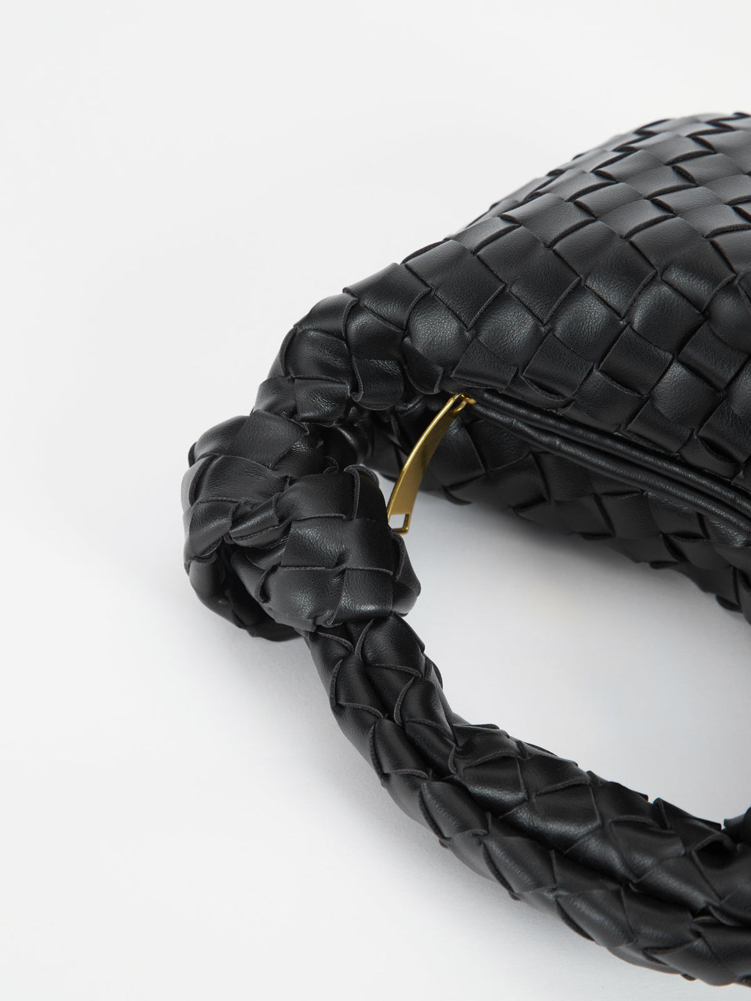 Fashionable women's shoulder bag showcasing a beautiful braided texture and chic knot handles.