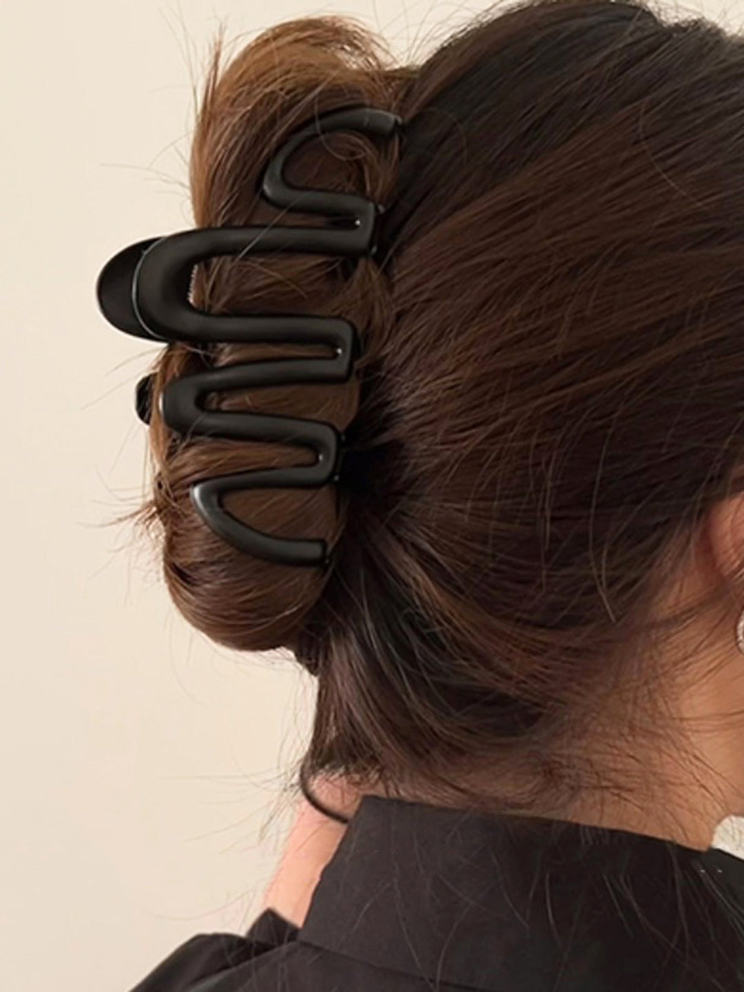 Women's Fluid Wave hair claw, an elegant metal hair accessory ideal for sophisticated updos & daily styling.