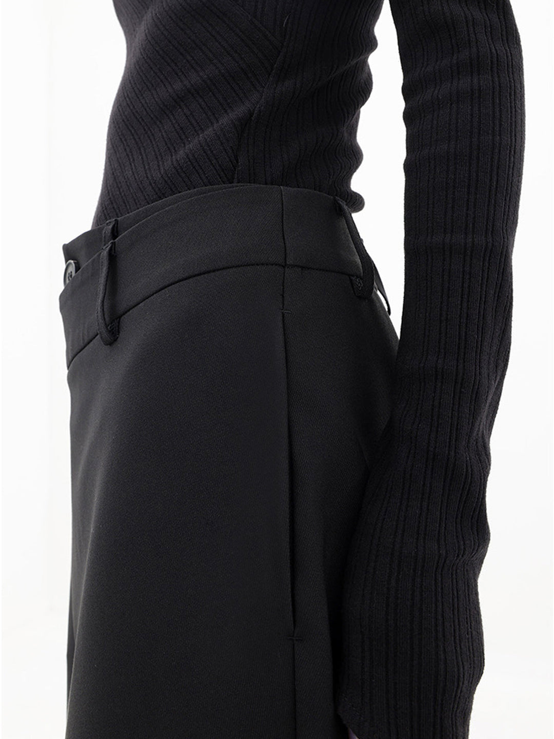 Effortless women's relaxed fit trousers, featuring a unique asymmetrical hem.
