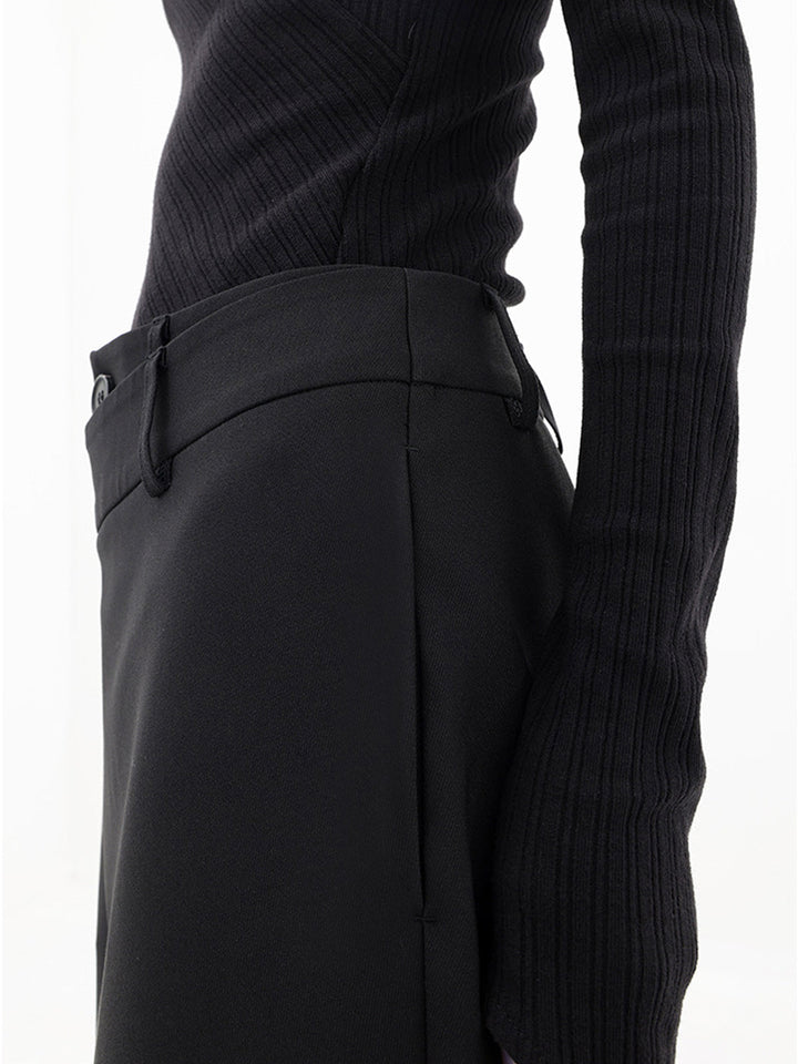 Effortless women's relaxed fit trousers, featuring a unique asymmetrical hem.