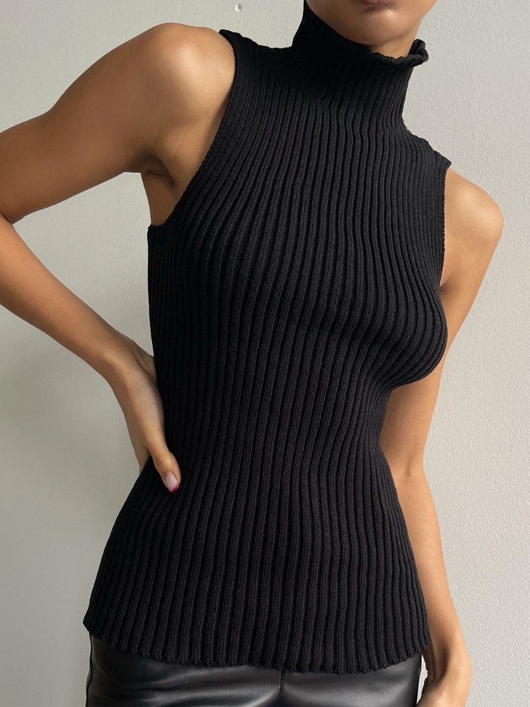 Ribbed sleeveless top for women with a mock neck. Versatile, casual chic, and perfect for year-round style & layering.