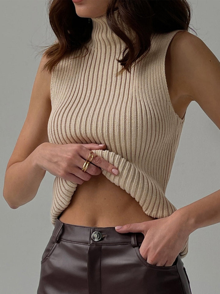 Women's ribbed sleeveless mock neck top, perfect for year-round style & versatile layering. Casual chic everyday wear.