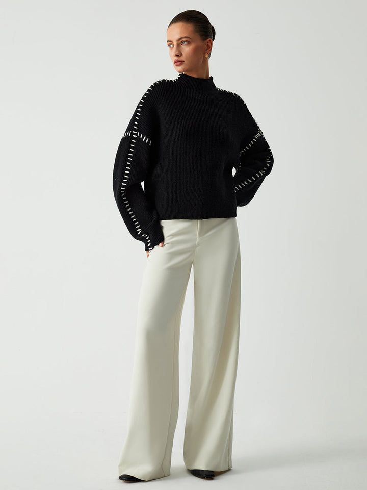 Fashionable oversized women's mock neck sweater, providing chic style and warmth for winter outfits.