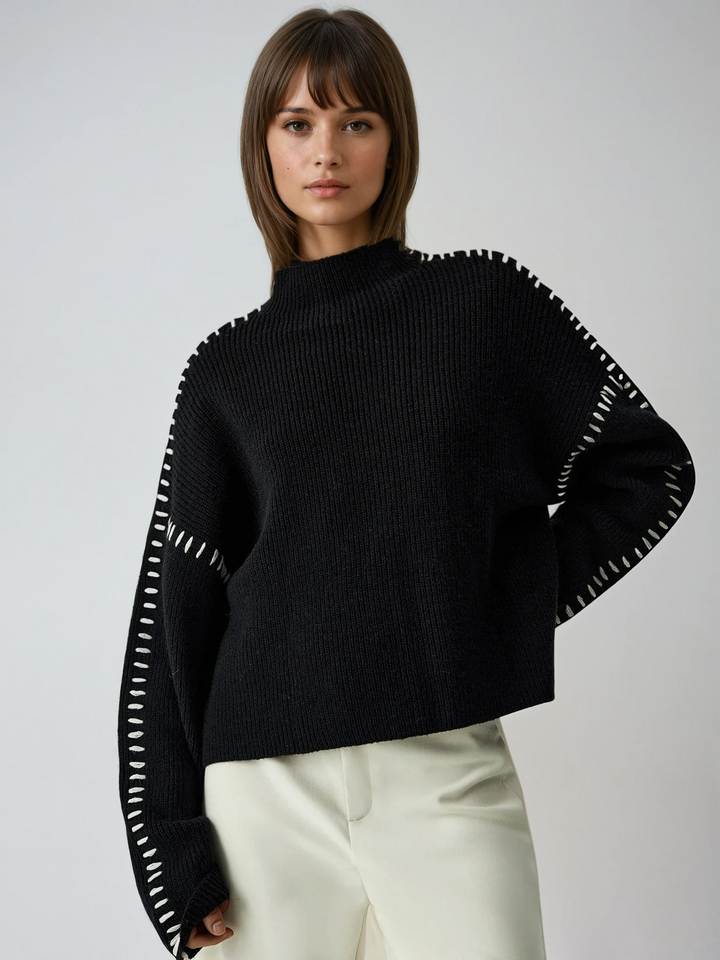 Chic women's oversized black mock neck sweater, perfect for winter warmth & effortless elegant style.