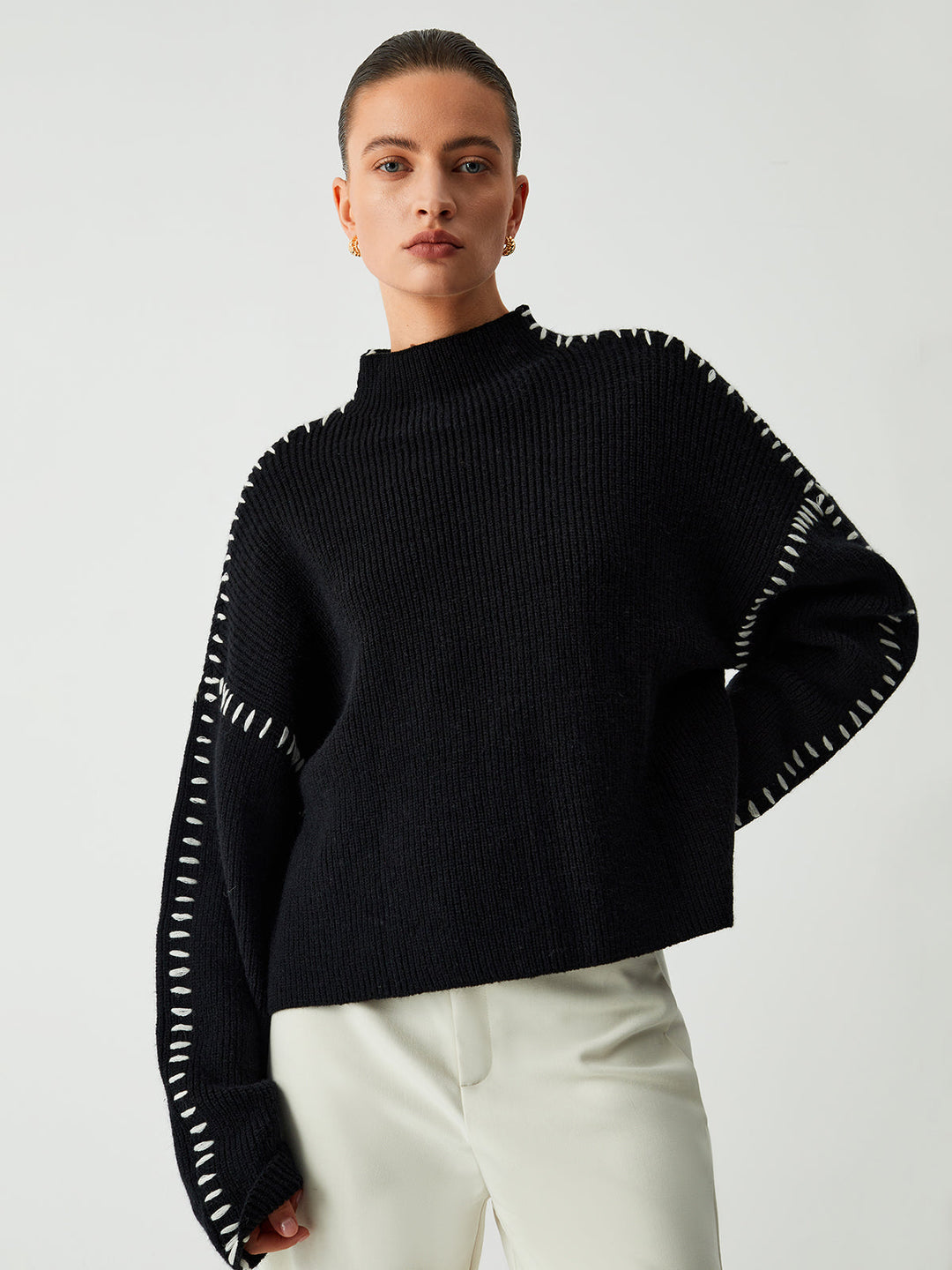 Cozy oversized women's mock neck sweater in black, ideal for comfortable casual wear & chic winter fashion.