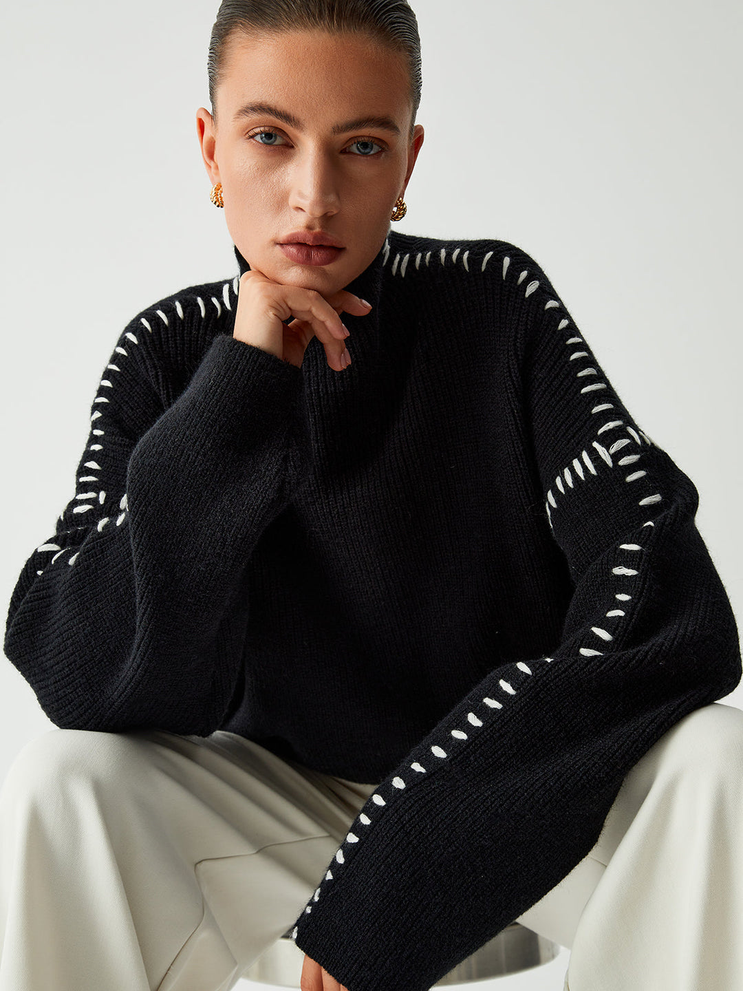 Warm & chic women's black oversized mock neck sweater, perfect for cozy comfort and elegant winter fashion.