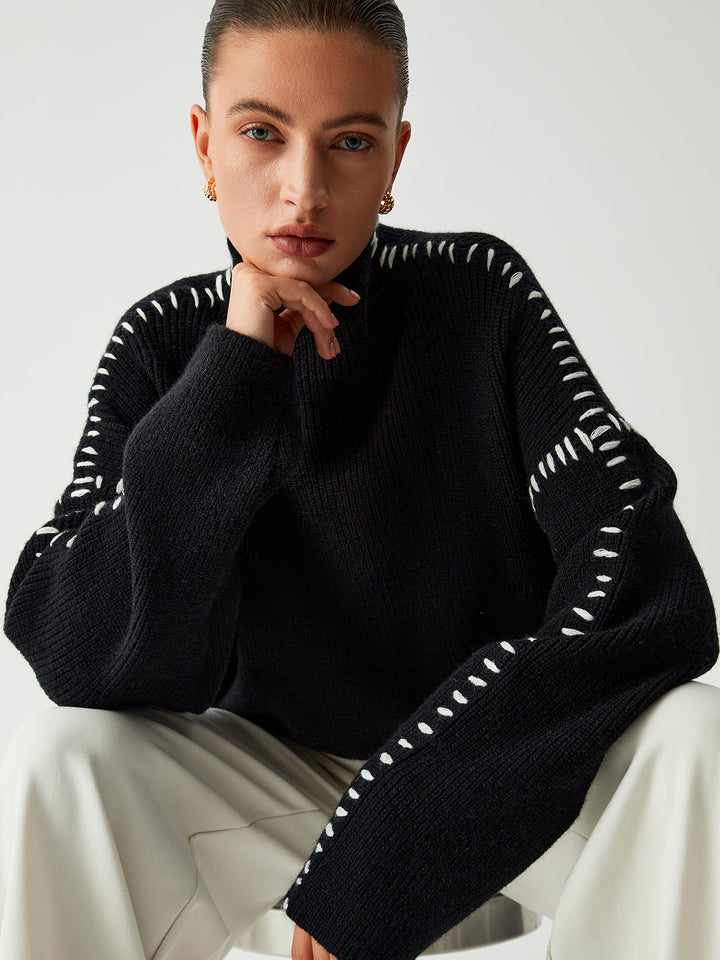 Warm & chic women's black oversized mock neck sweater, perfect for cozy comfort and elegant winter fashion.