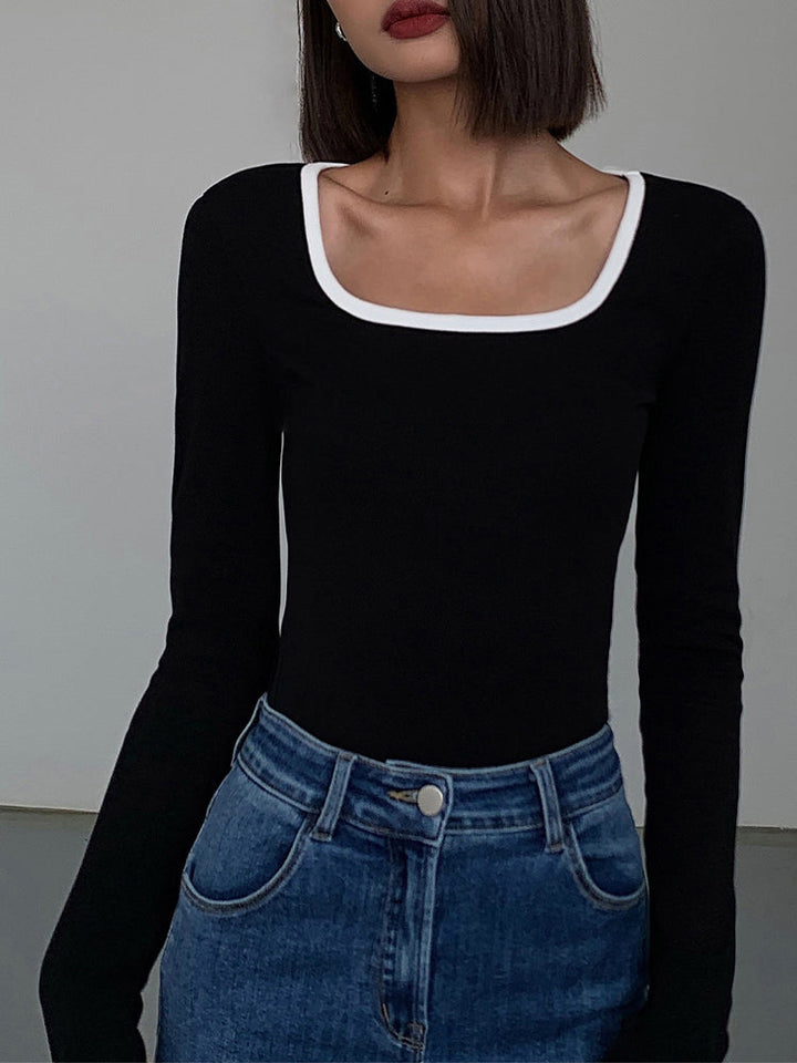 Chic black women's square neck top, white contrast trim. Modern short sleeve design, perfect for fashion.