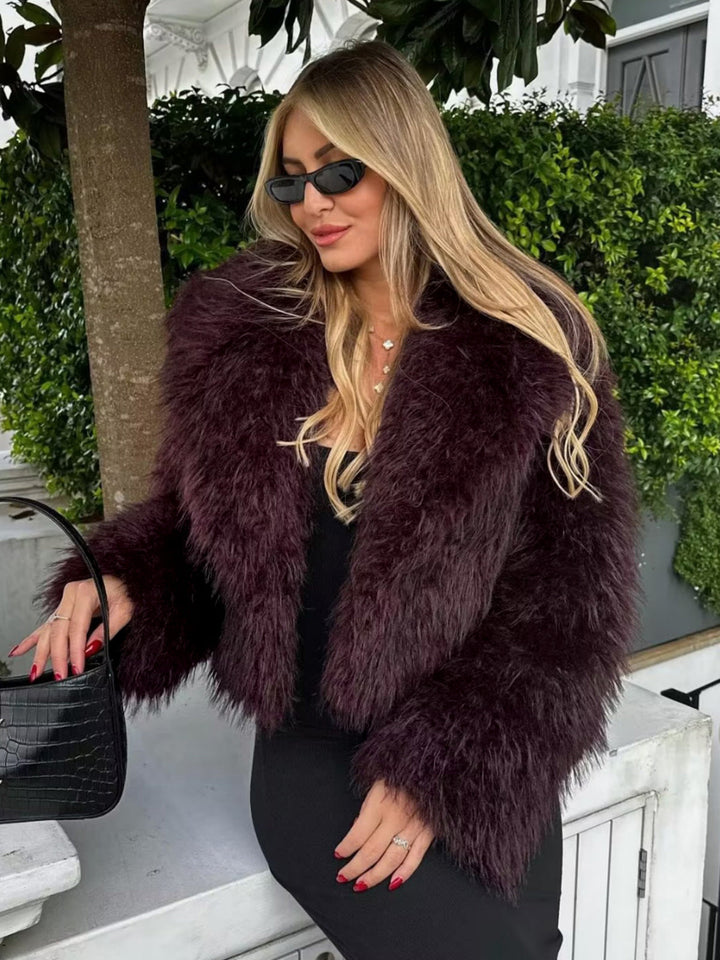 Stylish women's cropped jacket in burgundy, ideal for winter fashion, outerwear, or chic evening attire.