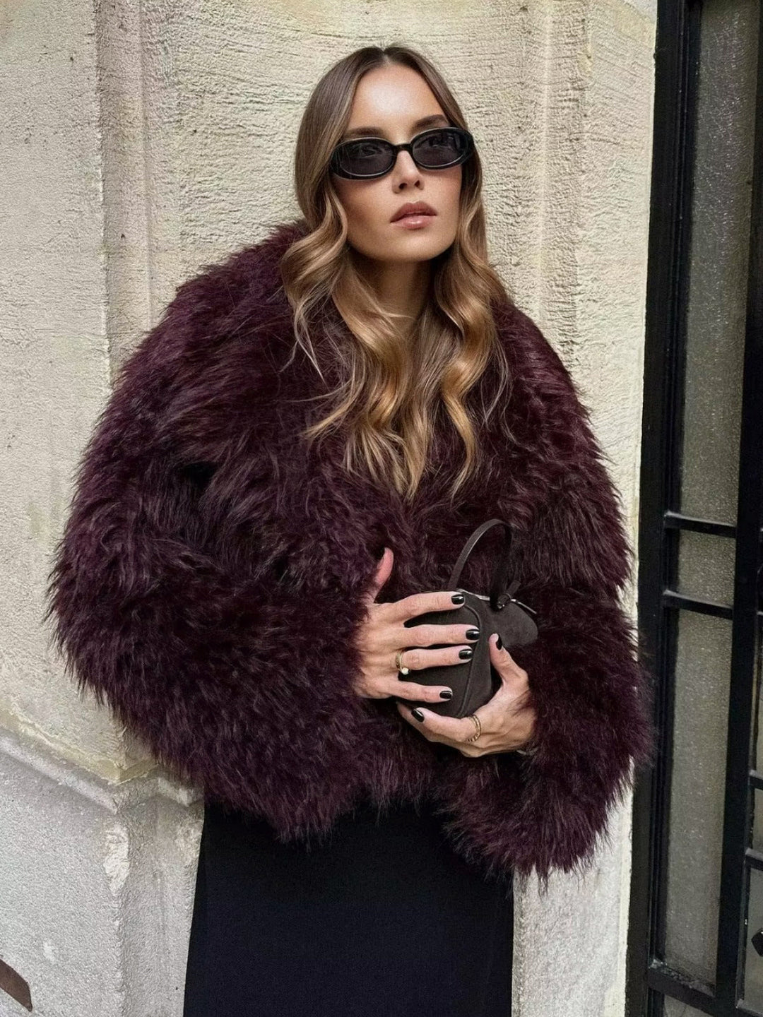 Chic cropped women's jacket, a glamorous statement piece for evening wear or stylish outerwear.
