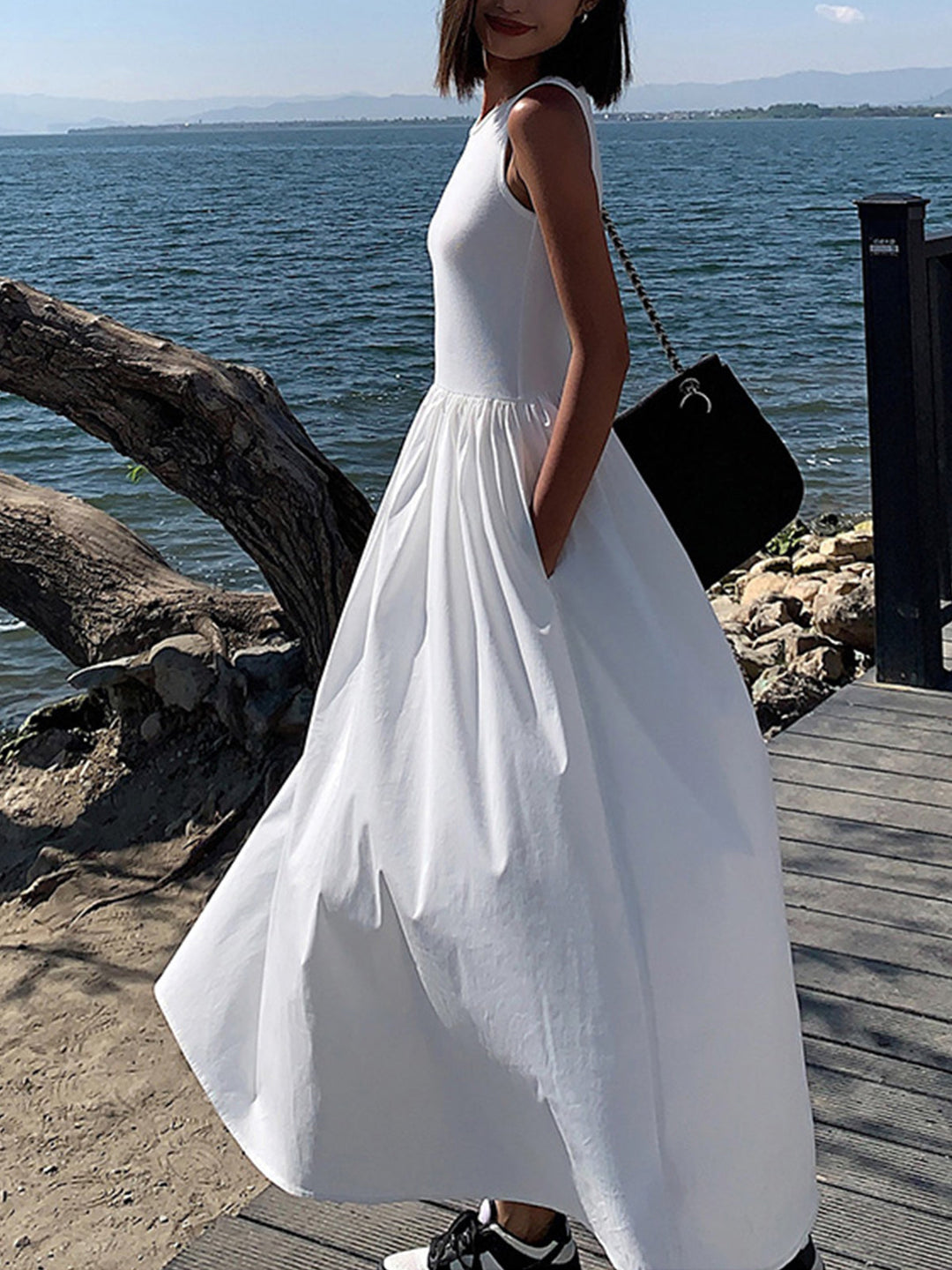 Black elegant sleeveless maxi dress for women. Perfect formal or evening wear.