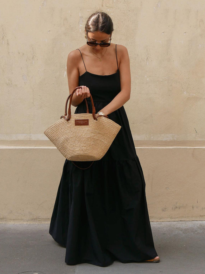 Stunning backless sleeveless maxi dress for women, embodying elegant summer vacation vibes.