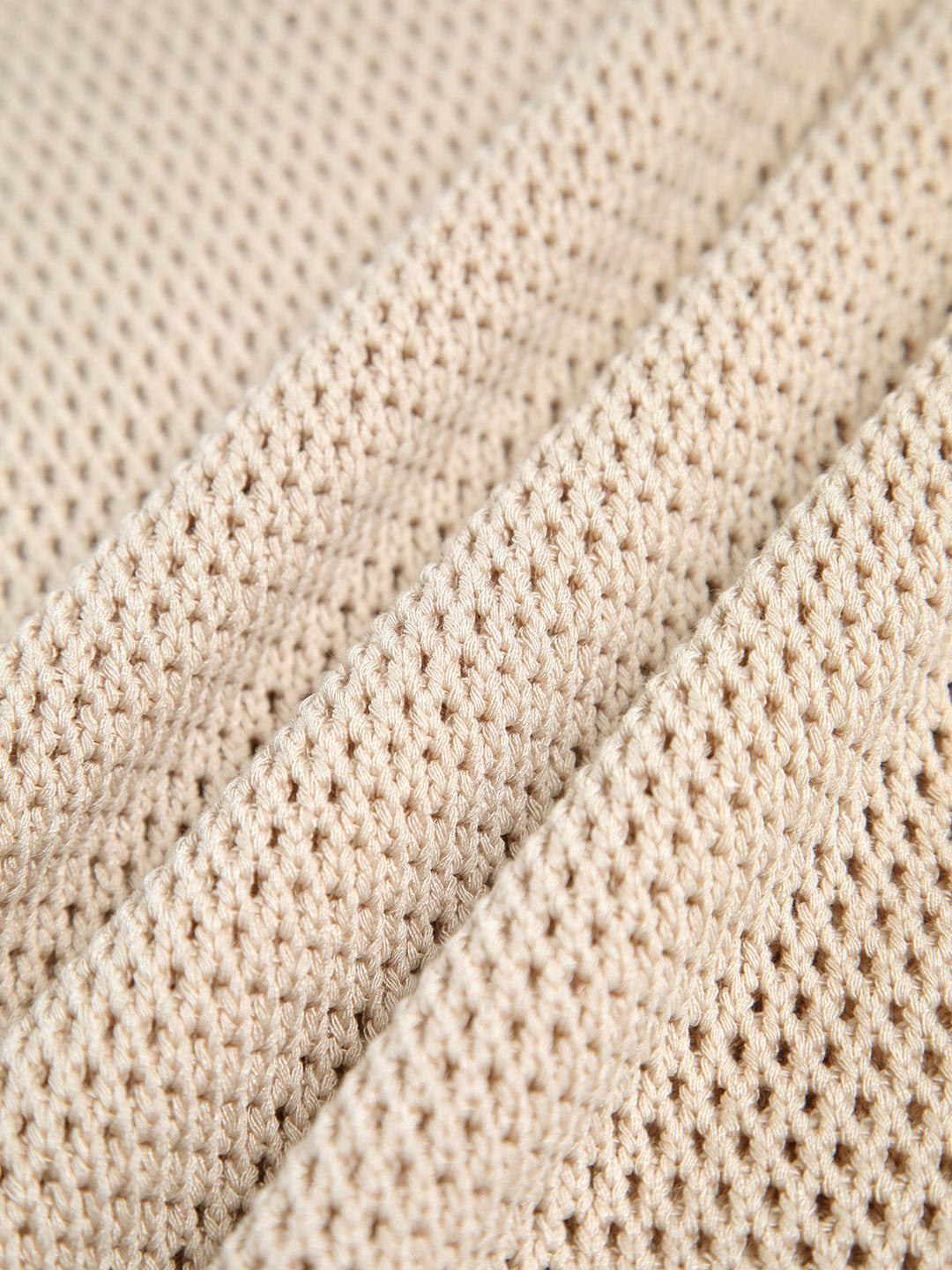 Essential women's sleeveless knit tank top, featuring cut-out detail, key for versatile summer layering.