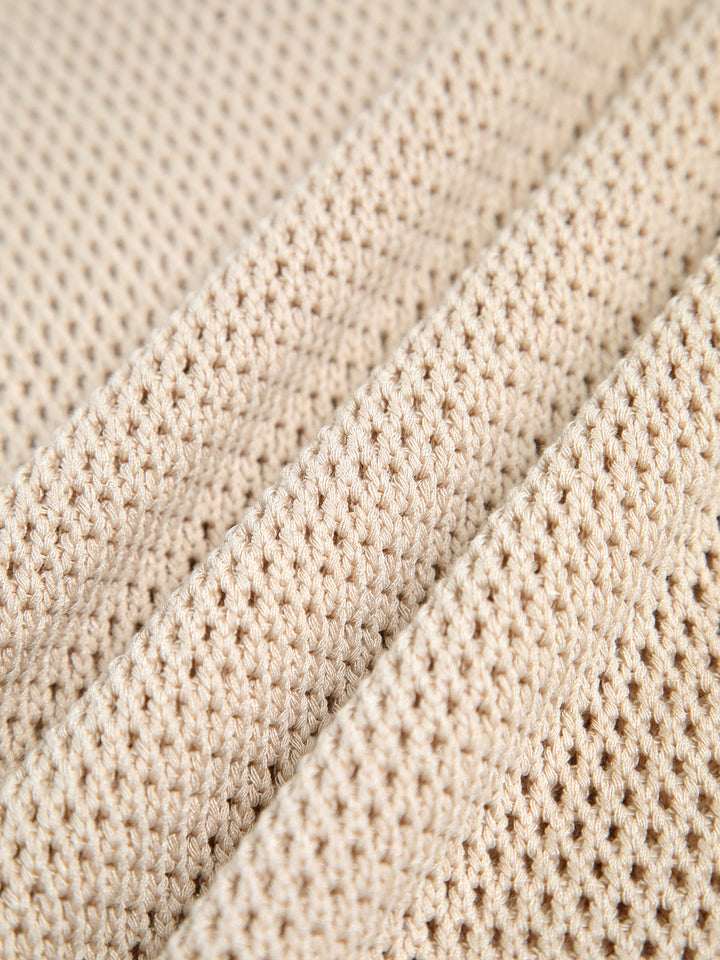 Essential women's sleeveless knit tank top, featuring cut-out detail, key for versatile summer layering.