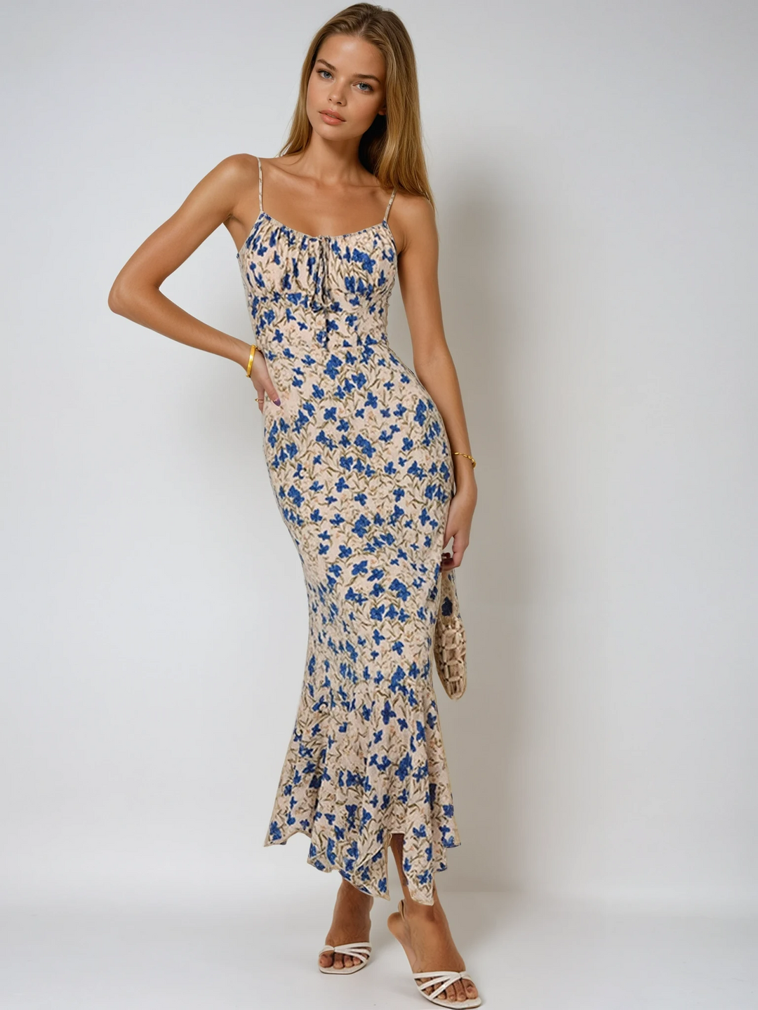 Women's floral summer maxi dress with elegant ruched spaghetti straps, perfect for warm weather fashion.