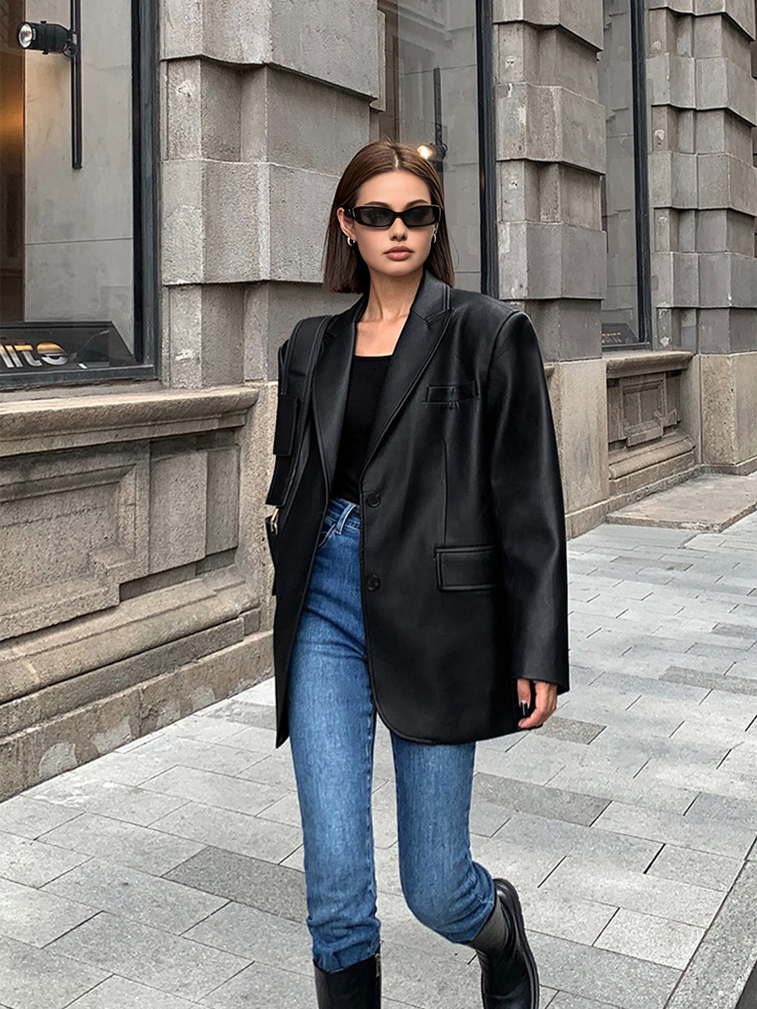 Stylish black or brown oversized women's blazer, a chic statement jacket with a flattering lapel collar.