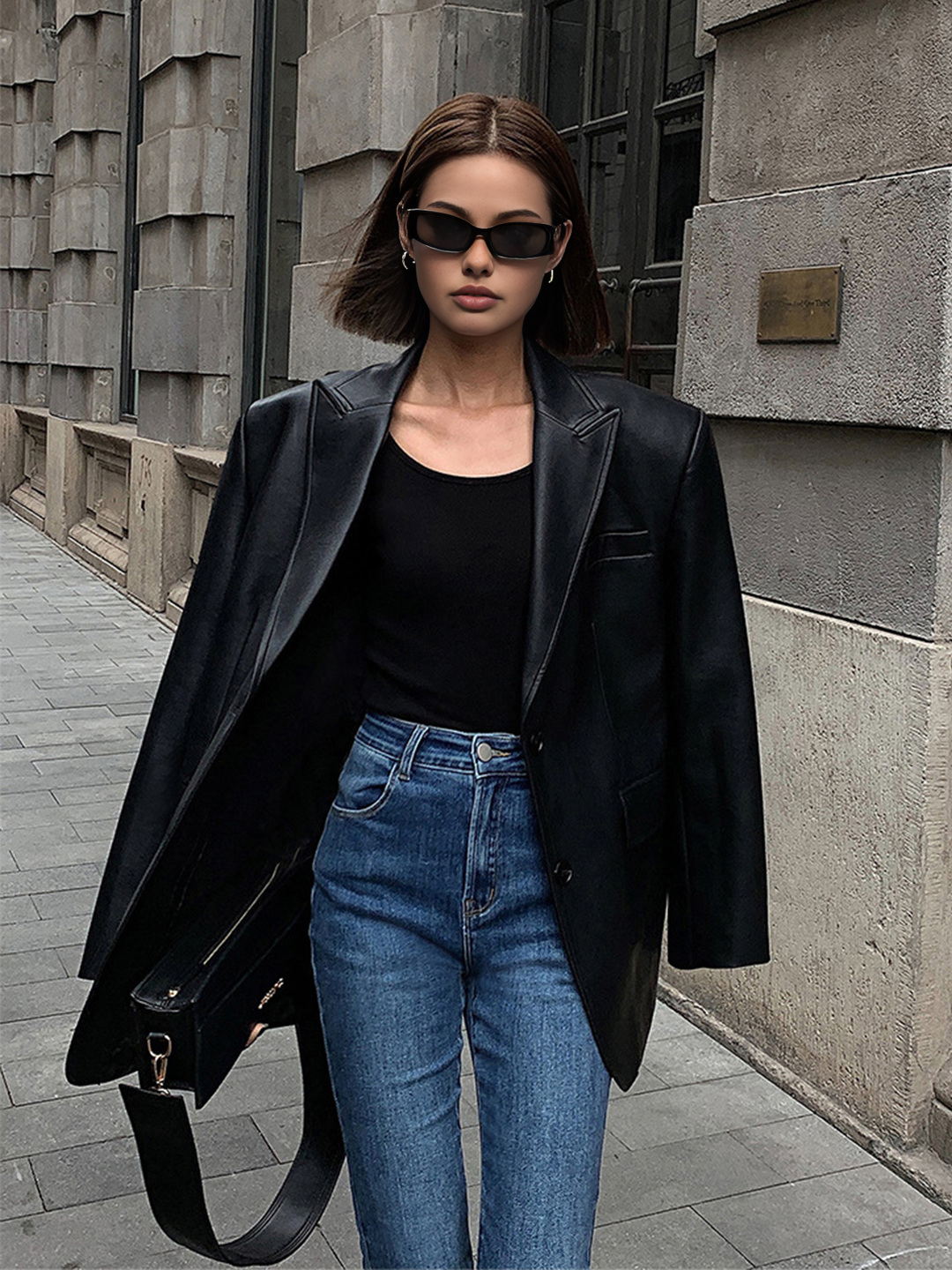 Chic oversized statement blazer for women, featuring a sharp lapel collar. Perfect versatile fashion for any season.