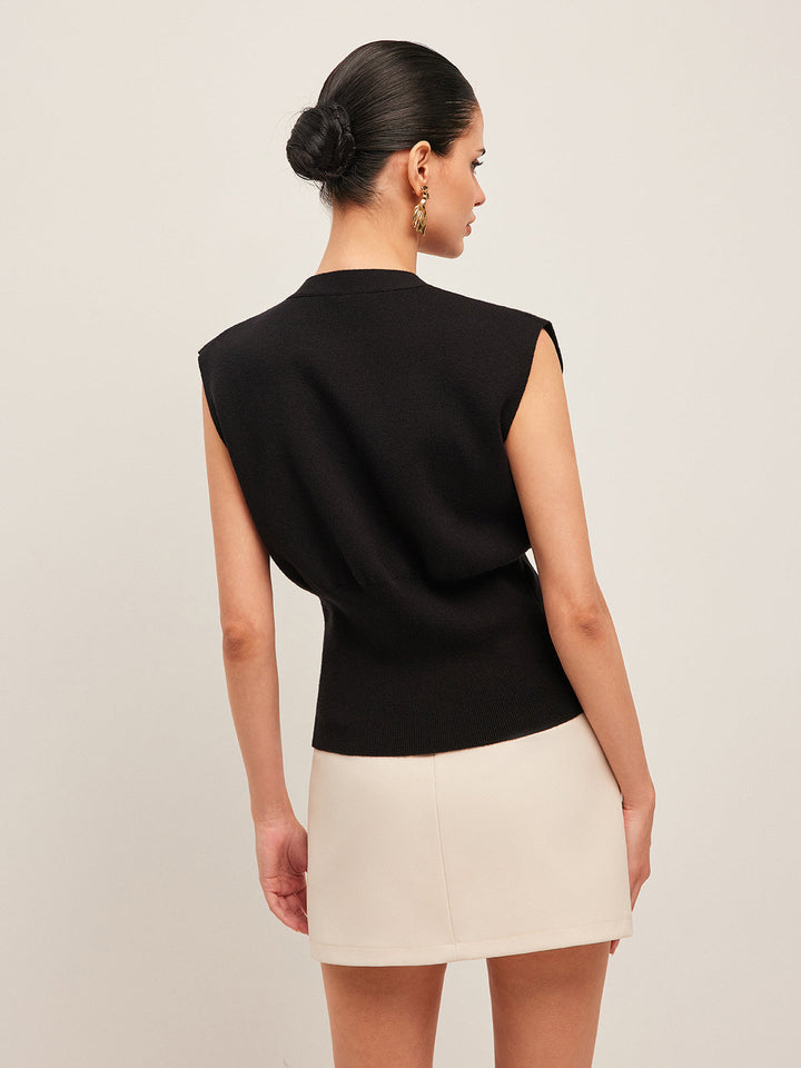 Highly versatile women's V-neck sweater vest with buttons, great for year-round layering and smart casual.