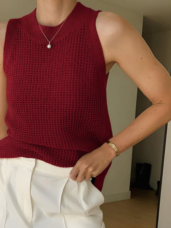 Stylish women's knit tank top featuring a unique cut-out detail, great for casual wear & summer style.