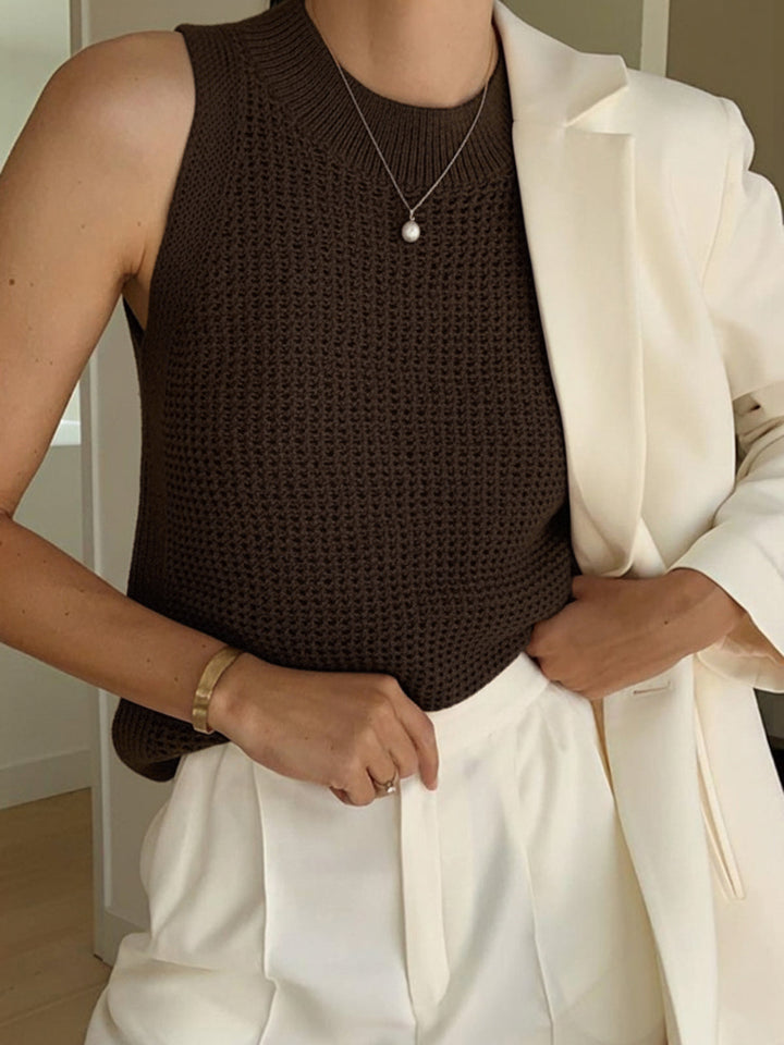 Women's knit sleeveless tank top with trendy cut-out detail, a versatile summer fashion layering piece.