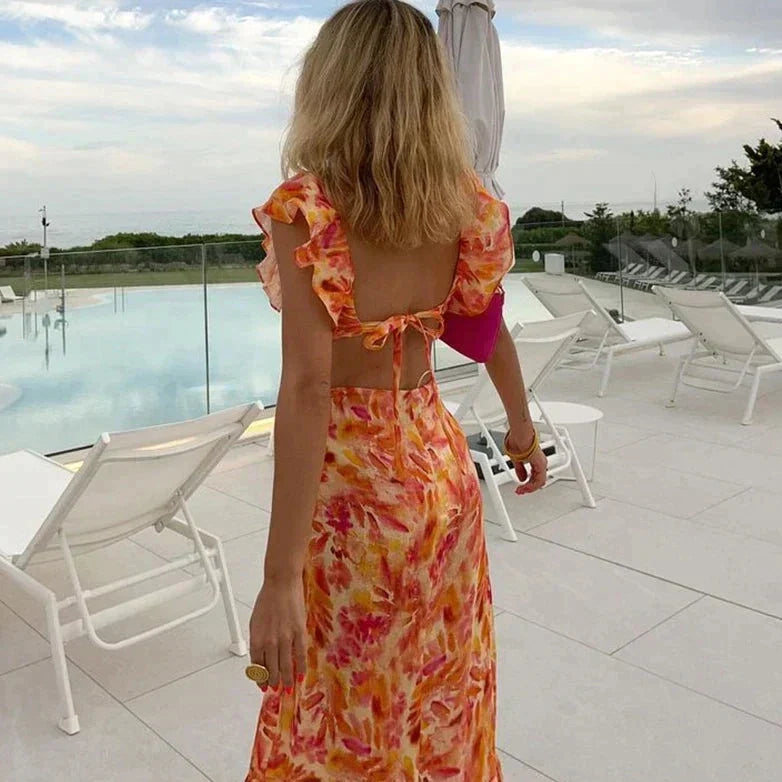Sophisticated women's long maxi dress, ideal for summer evenings, vacation, or comfortable resort wear. Flowy design.