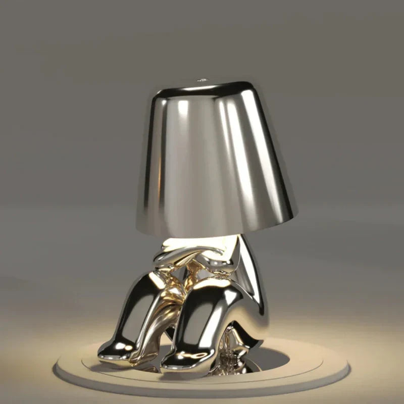 Cordless dimmable LED lamp. Artistic resin figurine design, portable for versatile accent lighting.