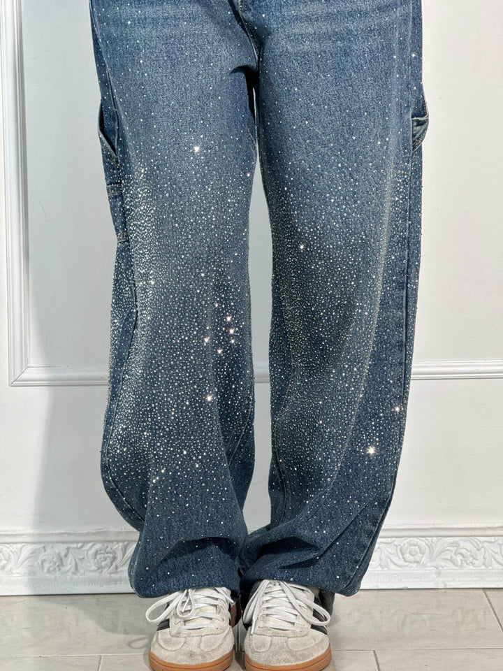 Shiny women's bottoms: sparkling balloon leg carpenter jeans, a fashionable and glamorous apparel piece.