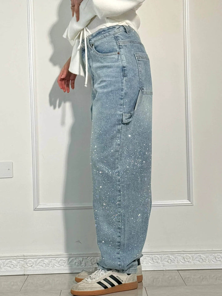 Stylish women's sparkling balloon leg carpenter jeans, designed for a trendy and relaxed silhouette.