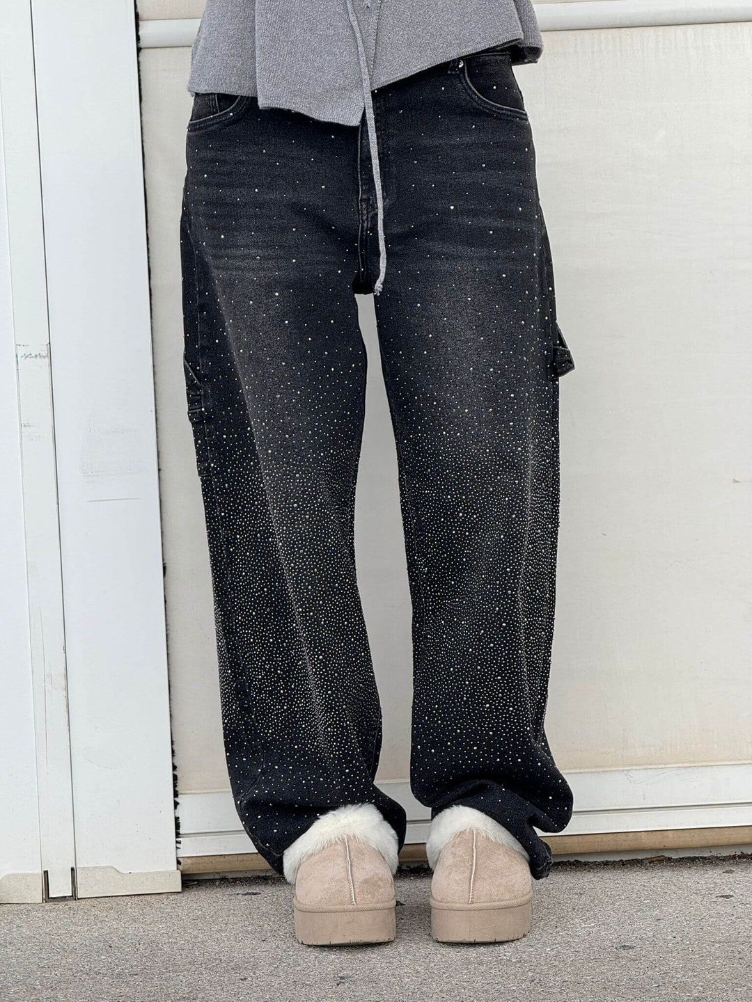 Fashion-forward women's sparkling balloon leg carpenter jeans, a shiny and trendy bottom option.