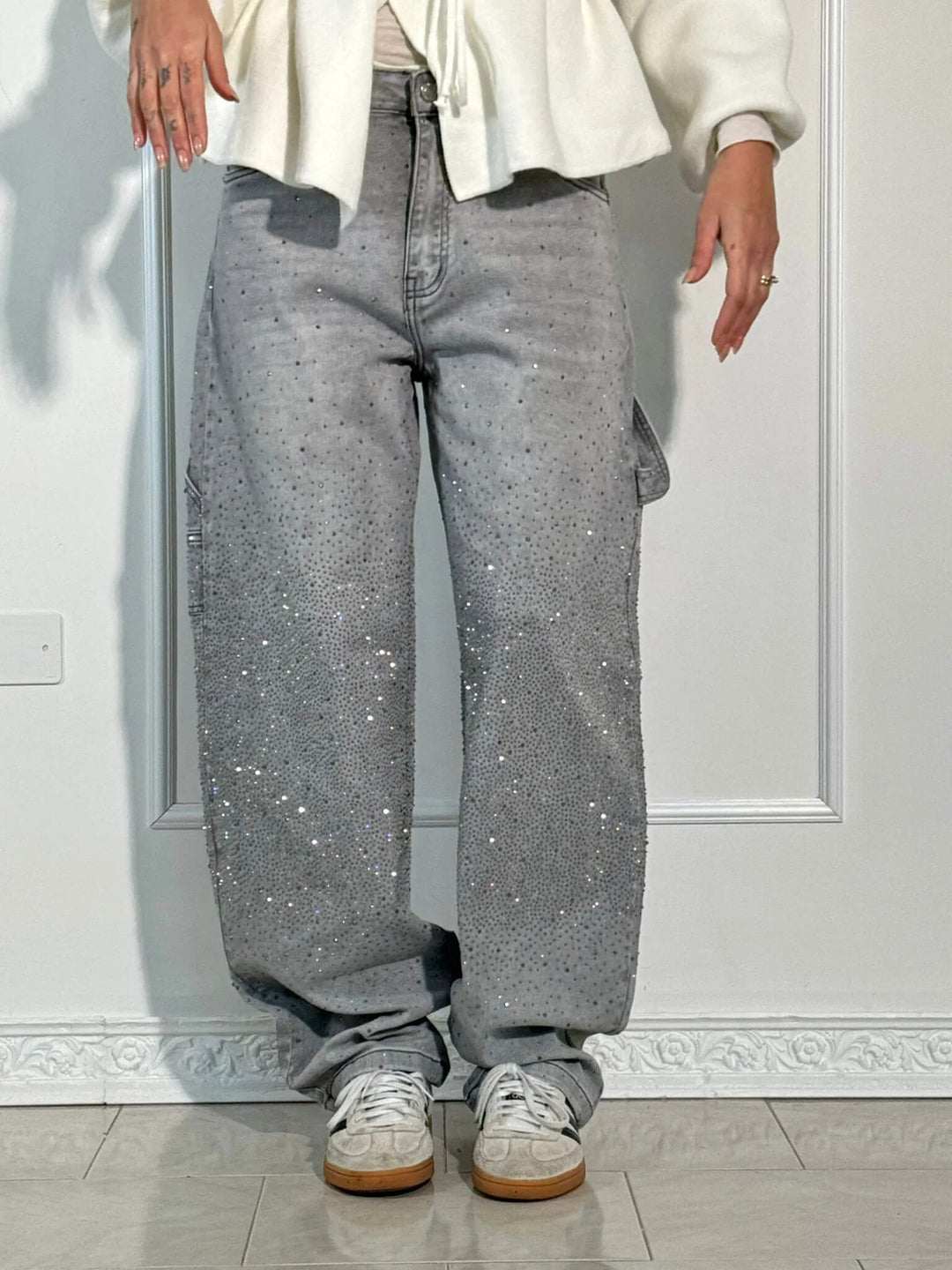 Women's sparkling balloon leg carpenter jeans, a relaxed fit apparel piece for a trendy, glamorous outfit.