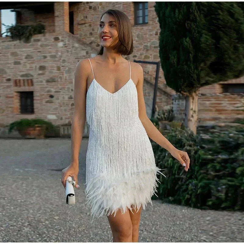 Glamorous sequin cocktail dress with feather trim, ideal for evening events and dances.
