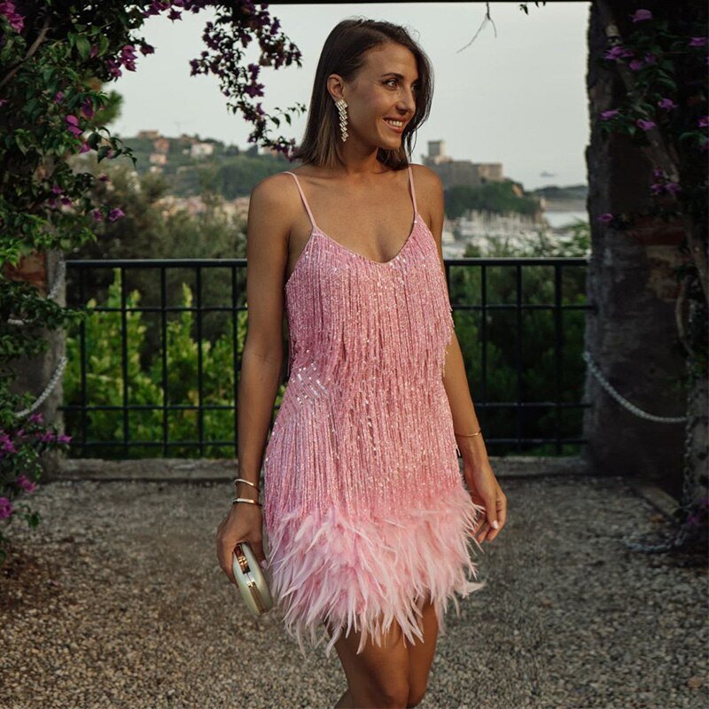 Women's spaghetti strap sequin feather dress, offering a dazzling and fashionable party look.