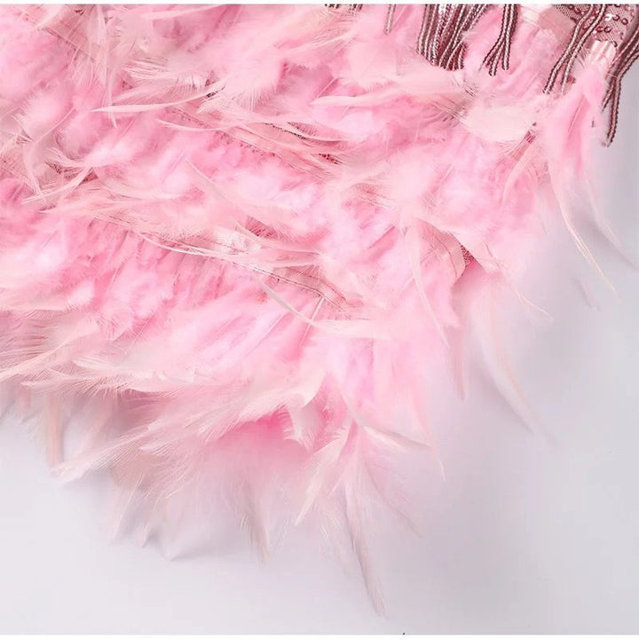 Front view of a glamorous women's sequin & feather cocktail dress, stunning for special occasions.