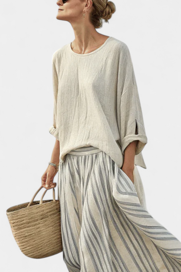 Chic women's two-piece beige set: striped midi skirt & comfortable drop-sleeve blouse. Effortless summer style.