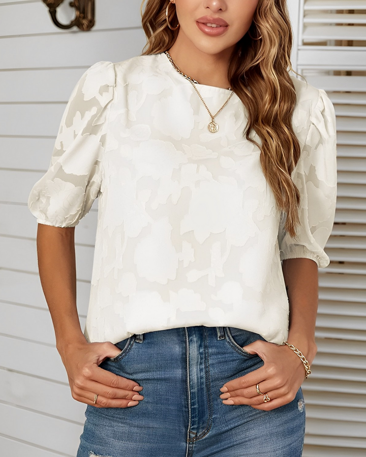 Sophisticated women's blouse with elegant puff sleeves, a stylish top perfect for chic fashion.