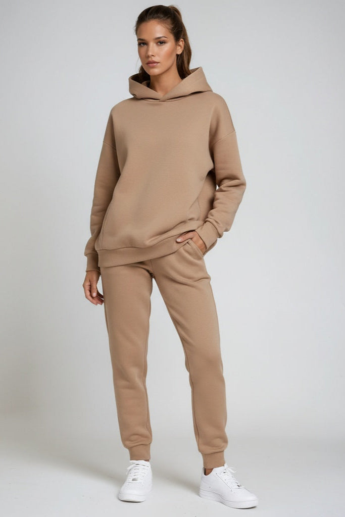Trendy women's loungewear set. Hooded sweatshirt & joggers offers stylish comfort for home or errands.