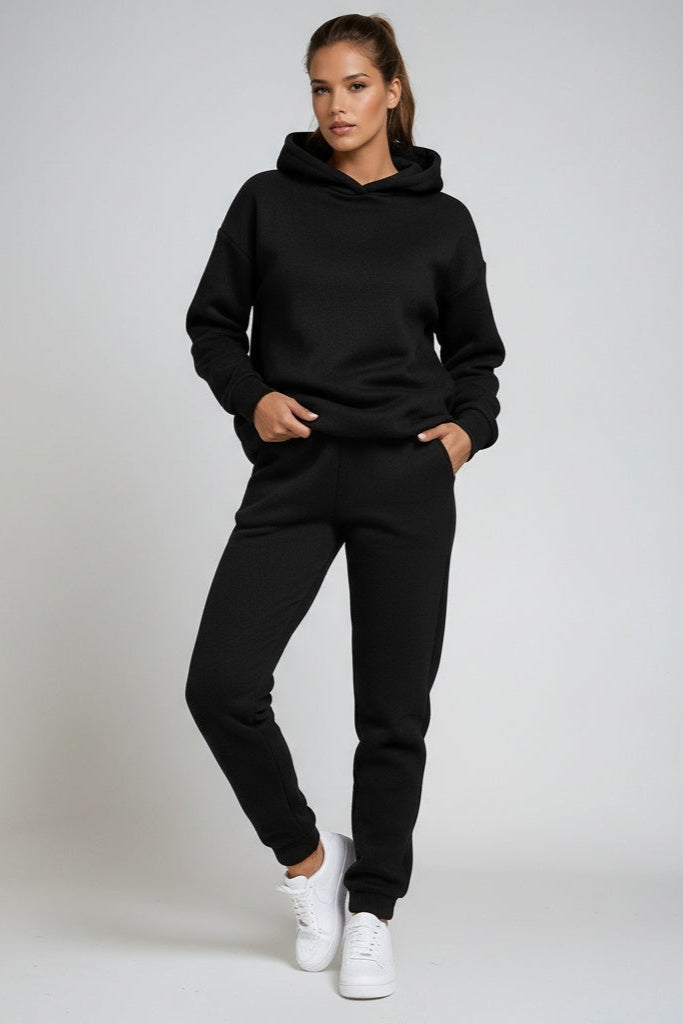 Women's two-piece comfort set: long sleeve hooded sweatshirt and relaxed fit joggers for everyday.