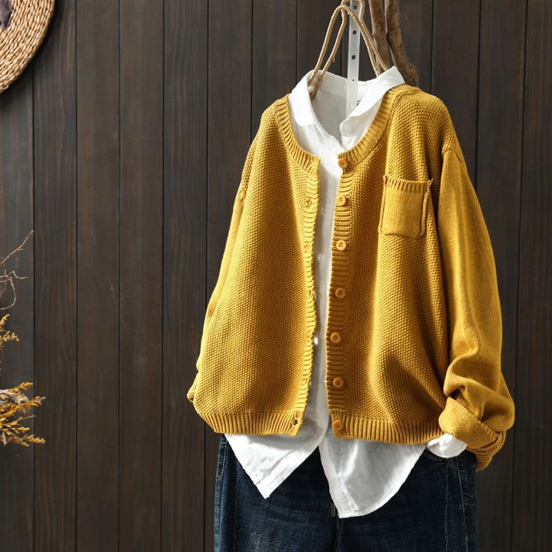 Women's cozy knit cardigan with functional front pockets. Soft & comfortable knitwear for stylish layering.