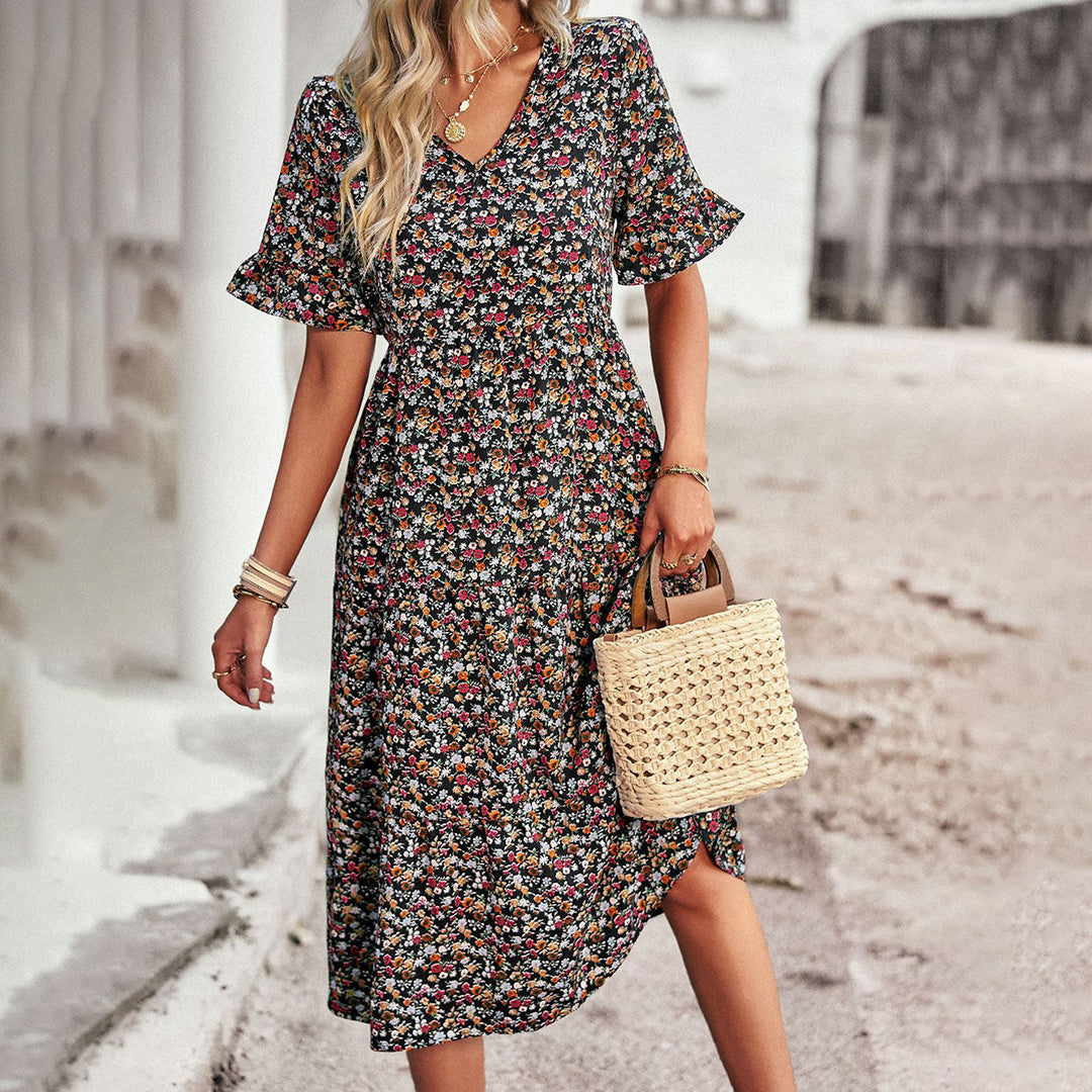Chic bohemian floral midi dress with flowy summer style, perfect for casual wear, vacation, or seasonal outfits.